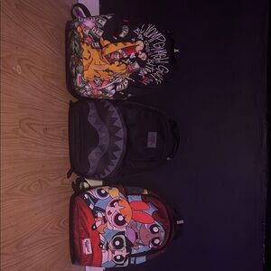 Sprayground Cartoon and Shark Backpack Trio